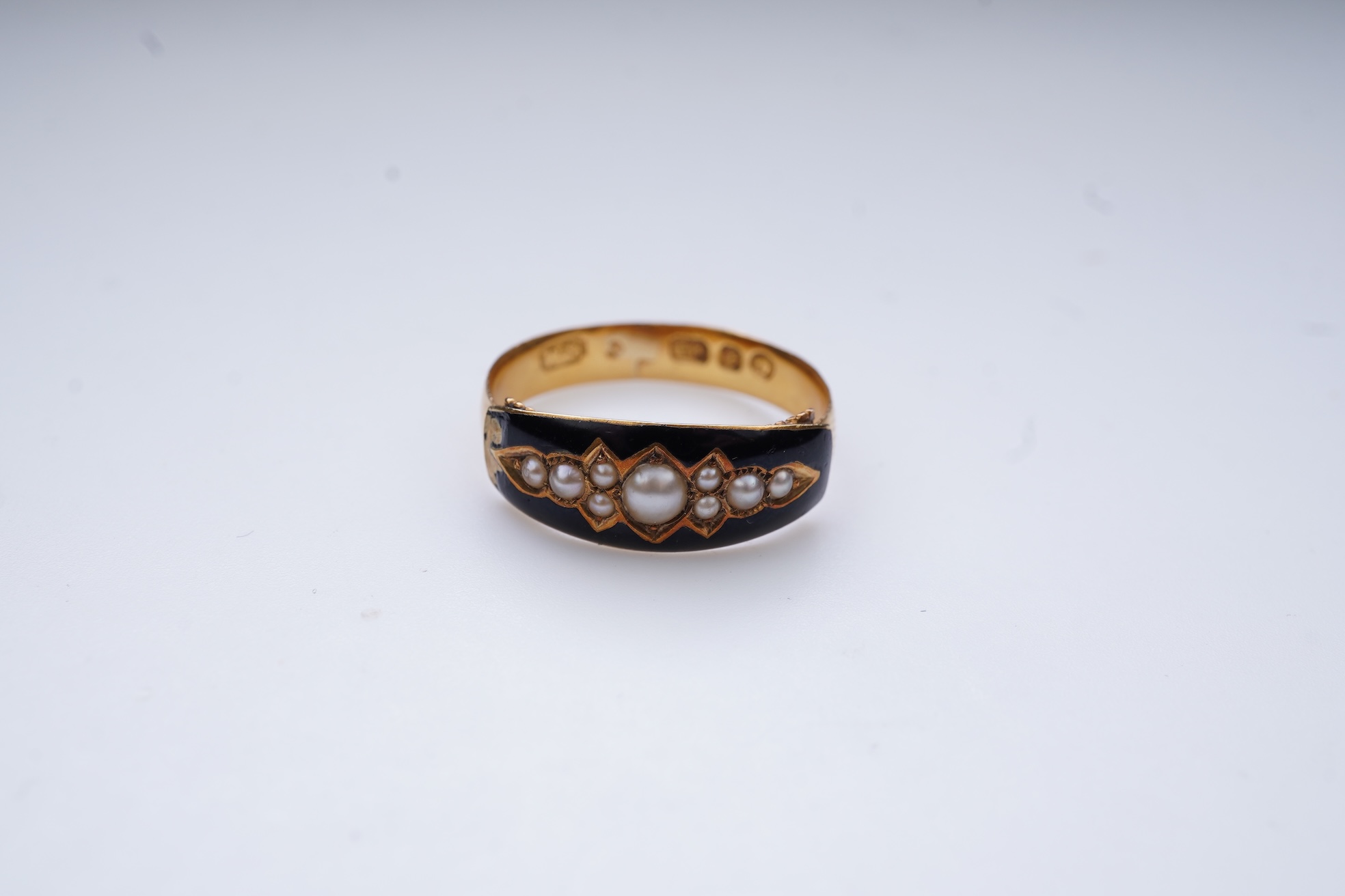 A Victorian black enamel and pearl mourning ring, 19th century